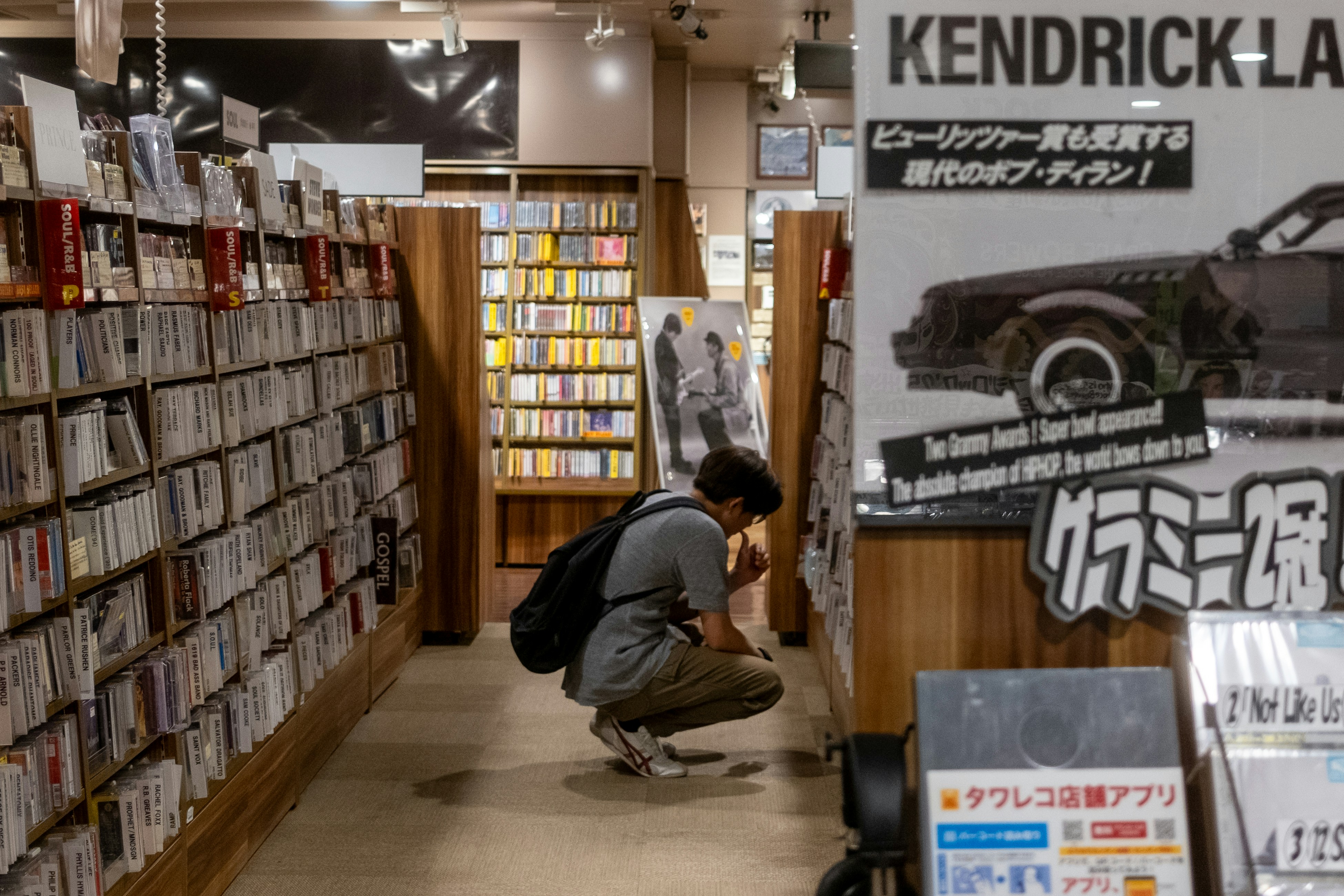 A person browses records in a music store.