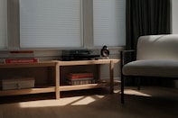 A living room with a record player and chair.