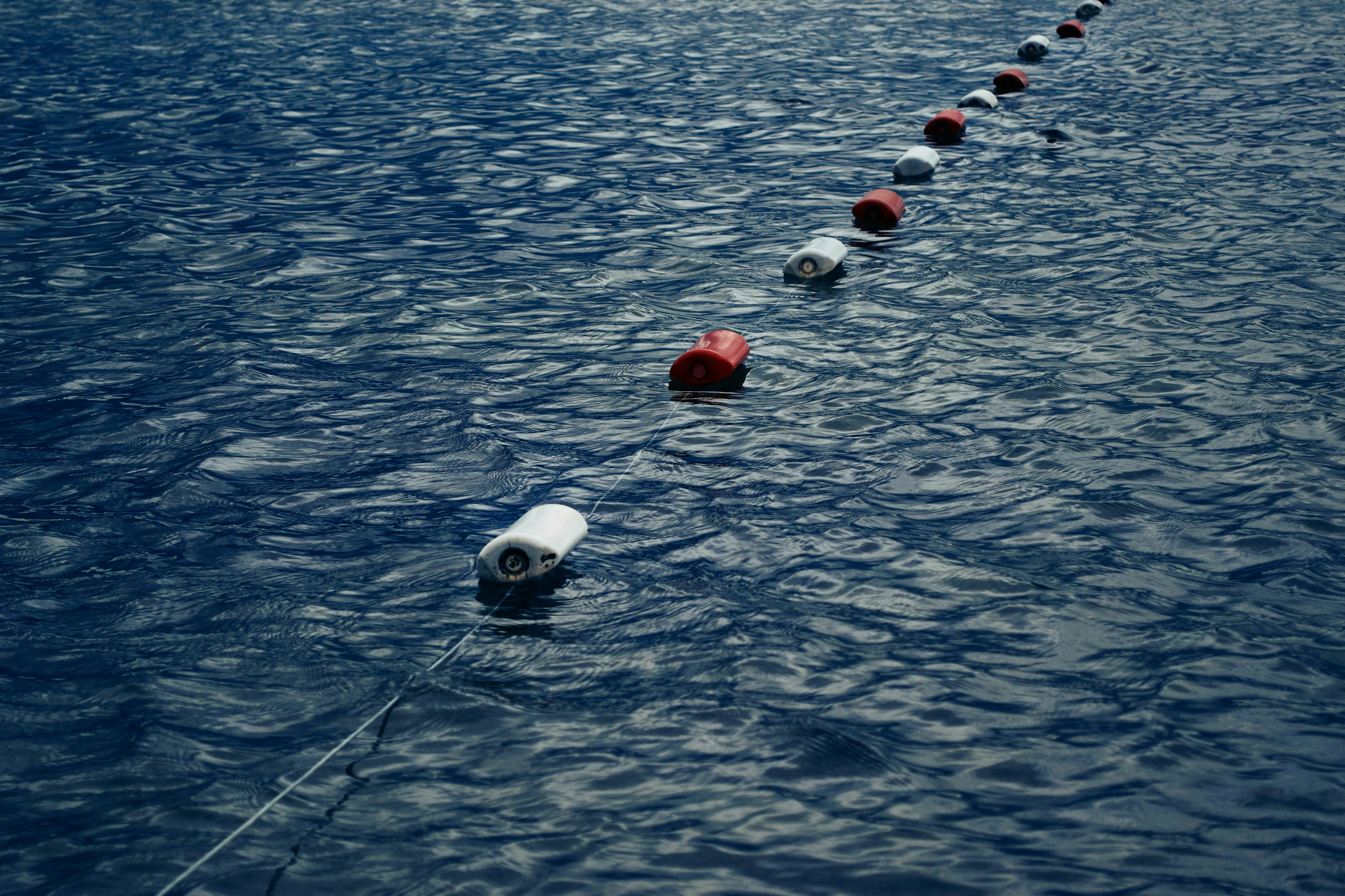 Navigational buoys in a channel, guiding boats and marking safe passage. - boating accident attorney