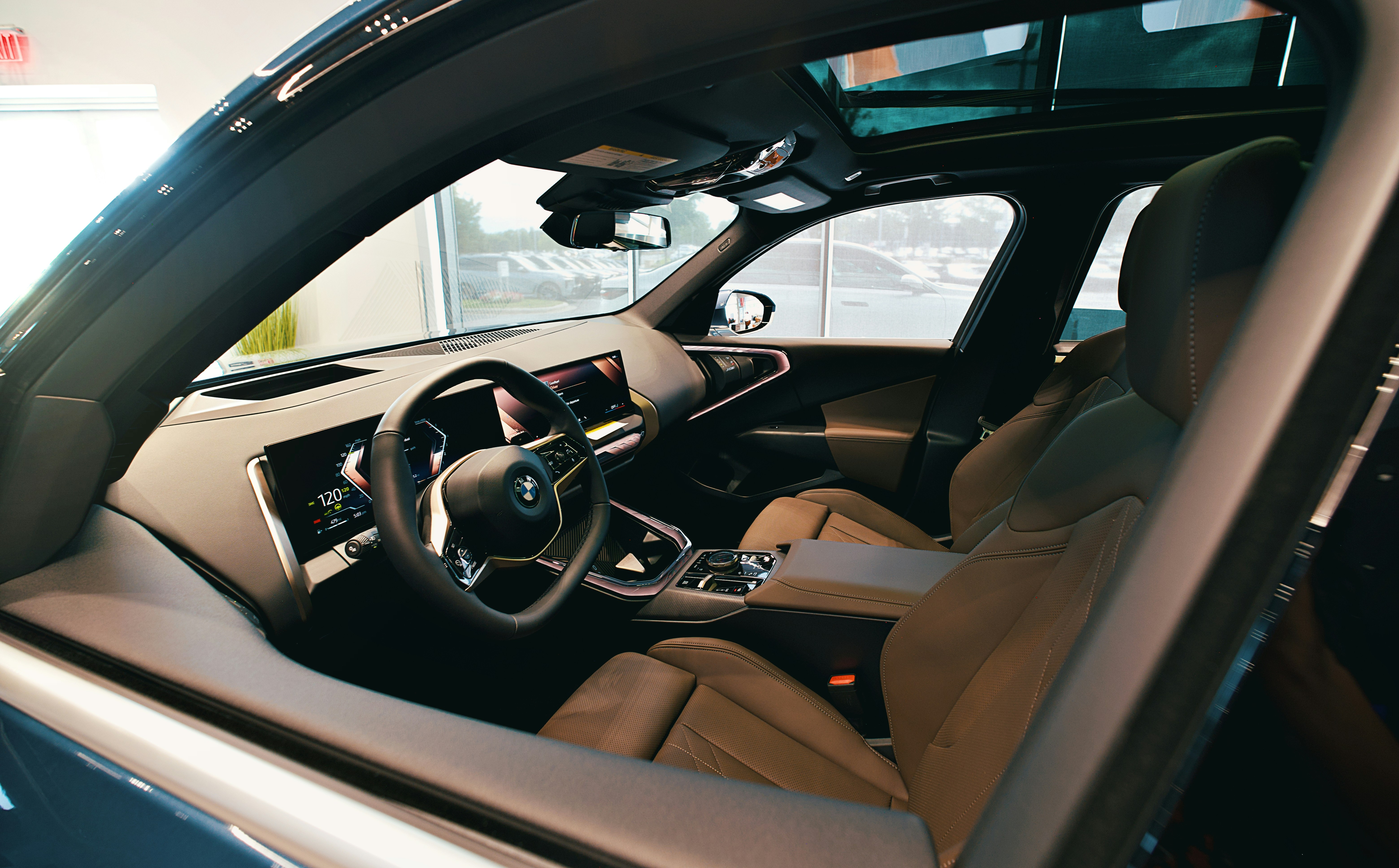 The interior of a luxury car with a sunroof.