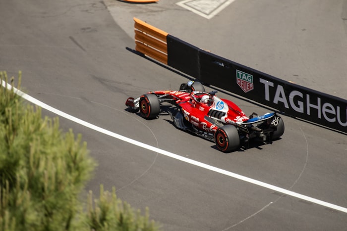 Formula One car speeding around a racetrack