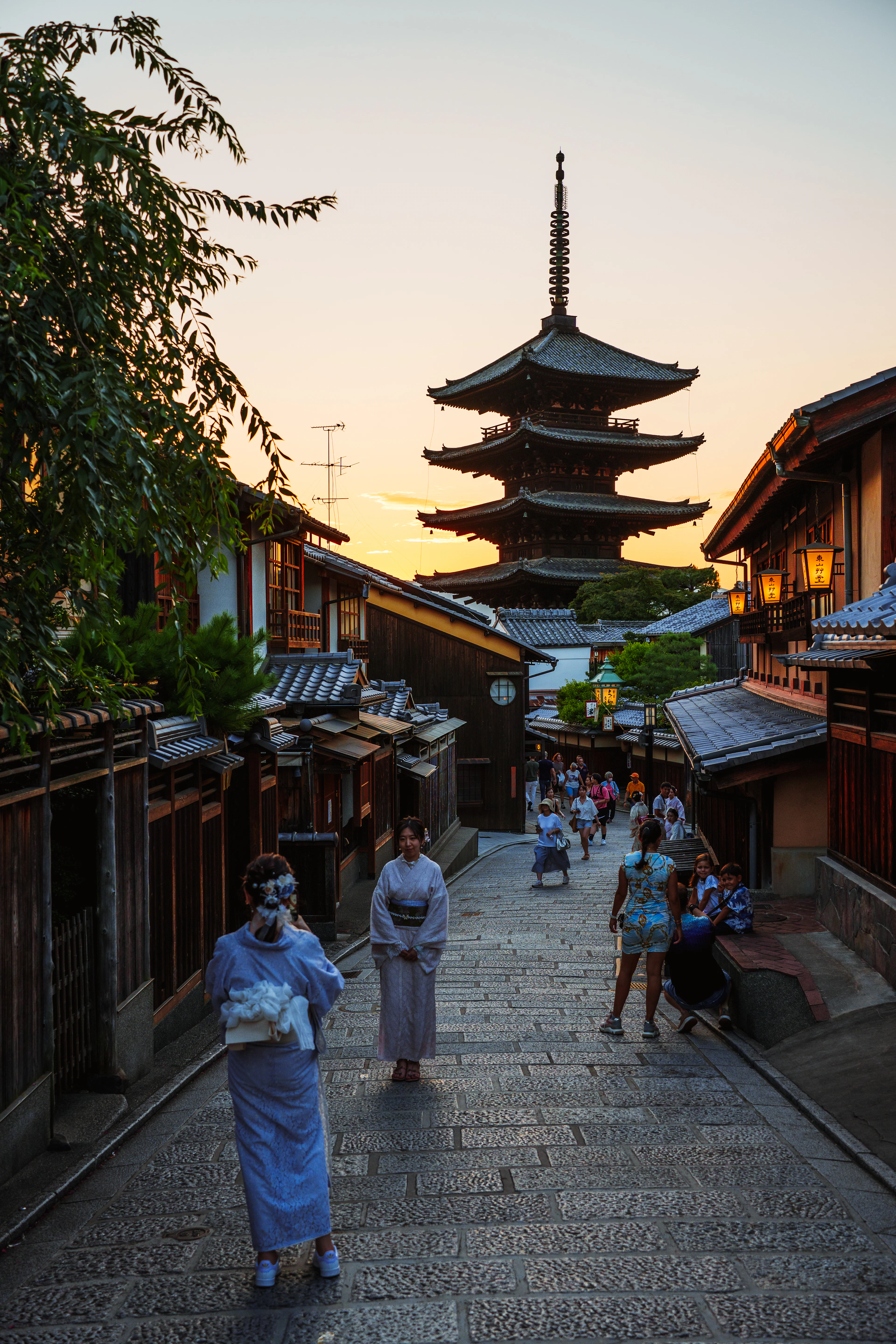 A traditional Kyoto street and pagoda in warm evening light