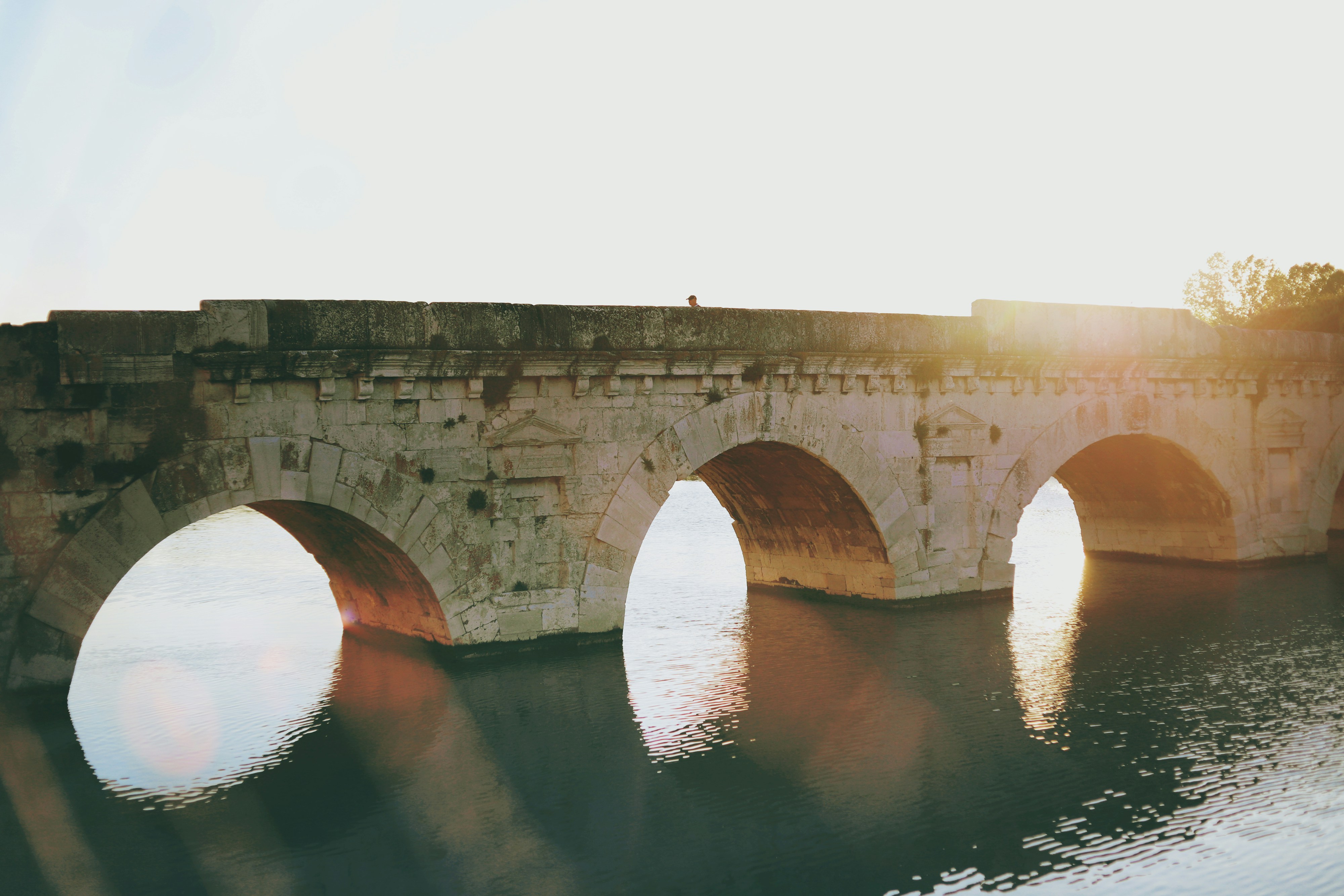An old bridge bathed in sunlight.