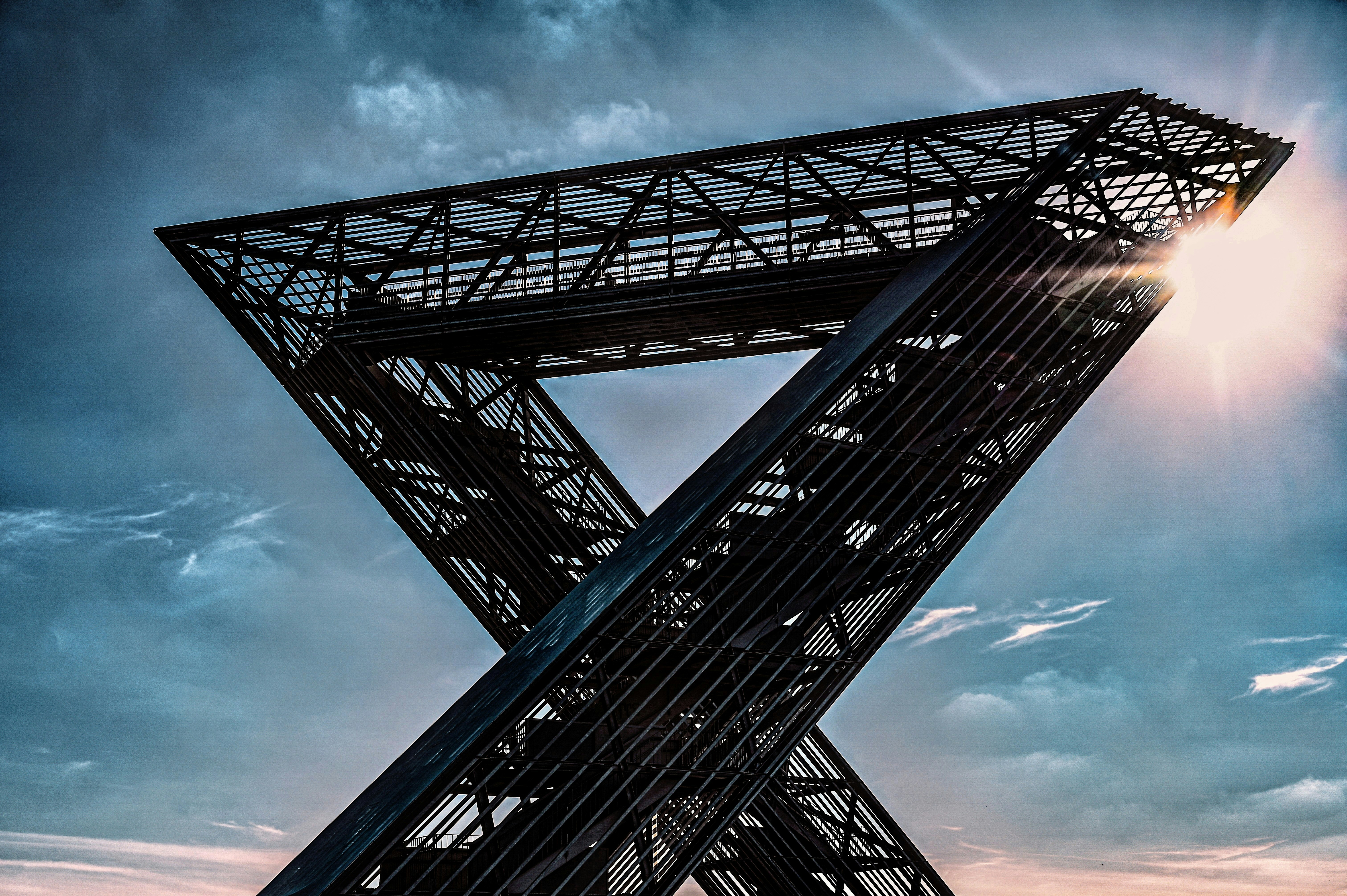 Steel structure stands tall against the sunlit sky.