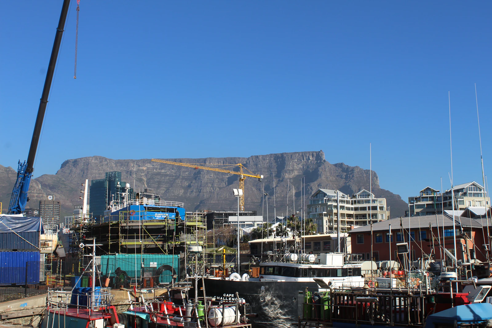 Boats in the V&A Waterfront harbour with Table Mountain behind