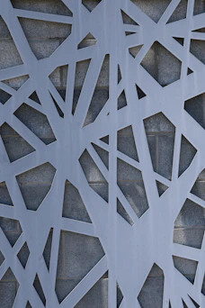 Geometric cutouts against brick wall.