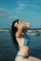 Anaya- Woman in blue bikini at the beach.