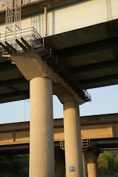 Concrete bridge supports are visible from below.