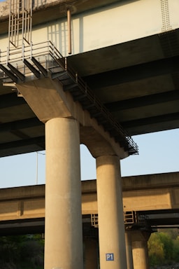 Concrete bridge supports are visible from below.