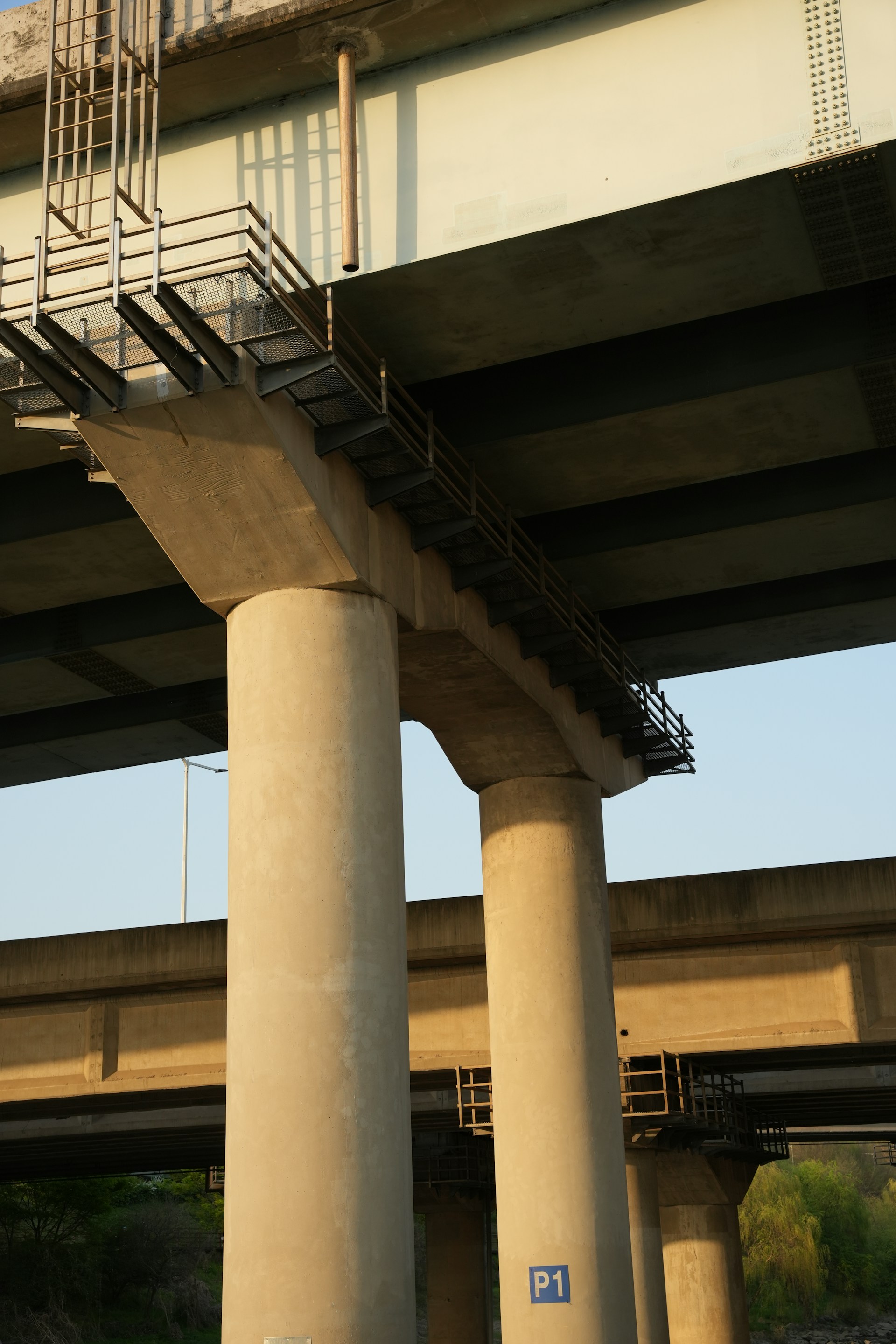 Concrete bridge supports are visible from below.