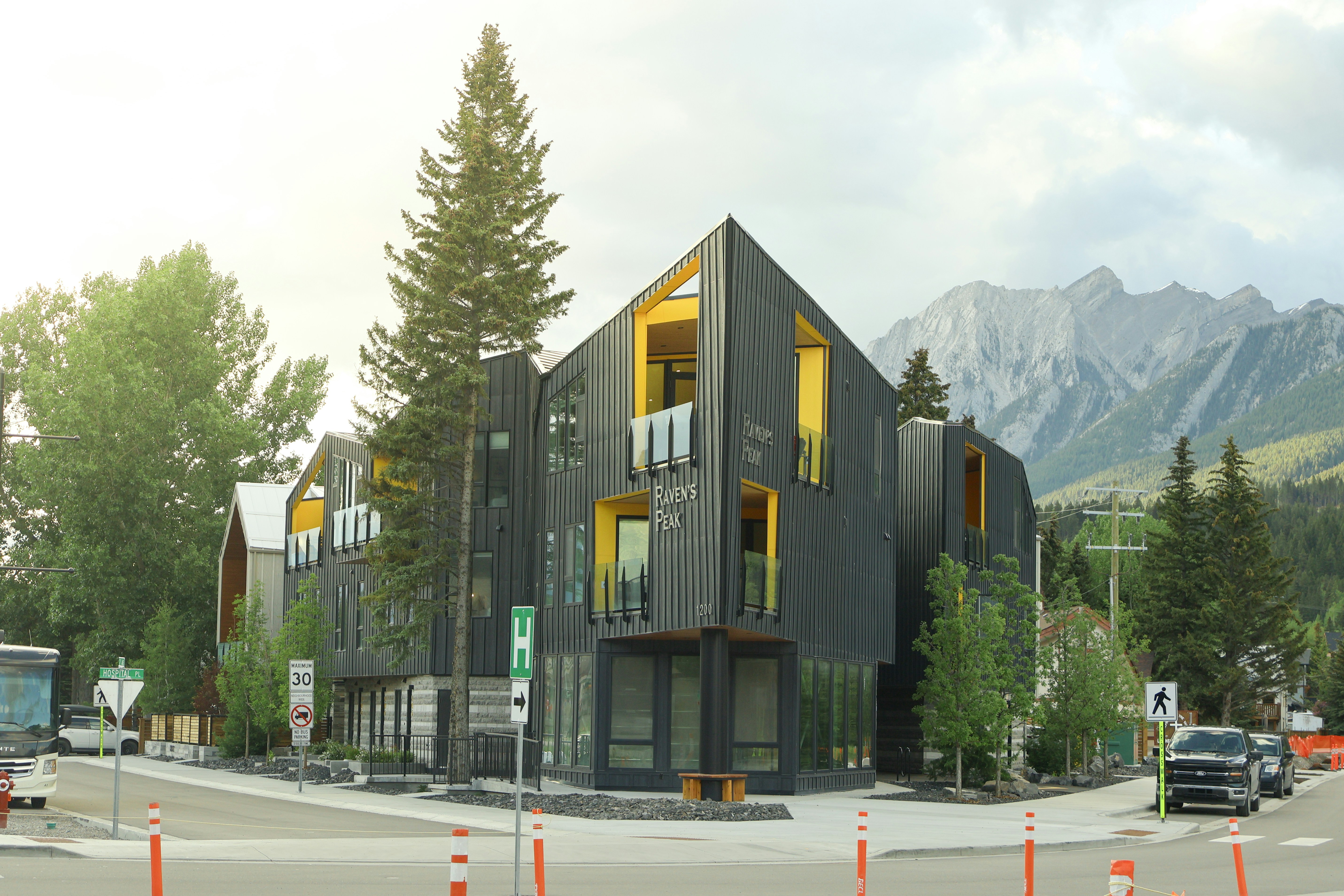 Modern building with mountain scenery in the background.