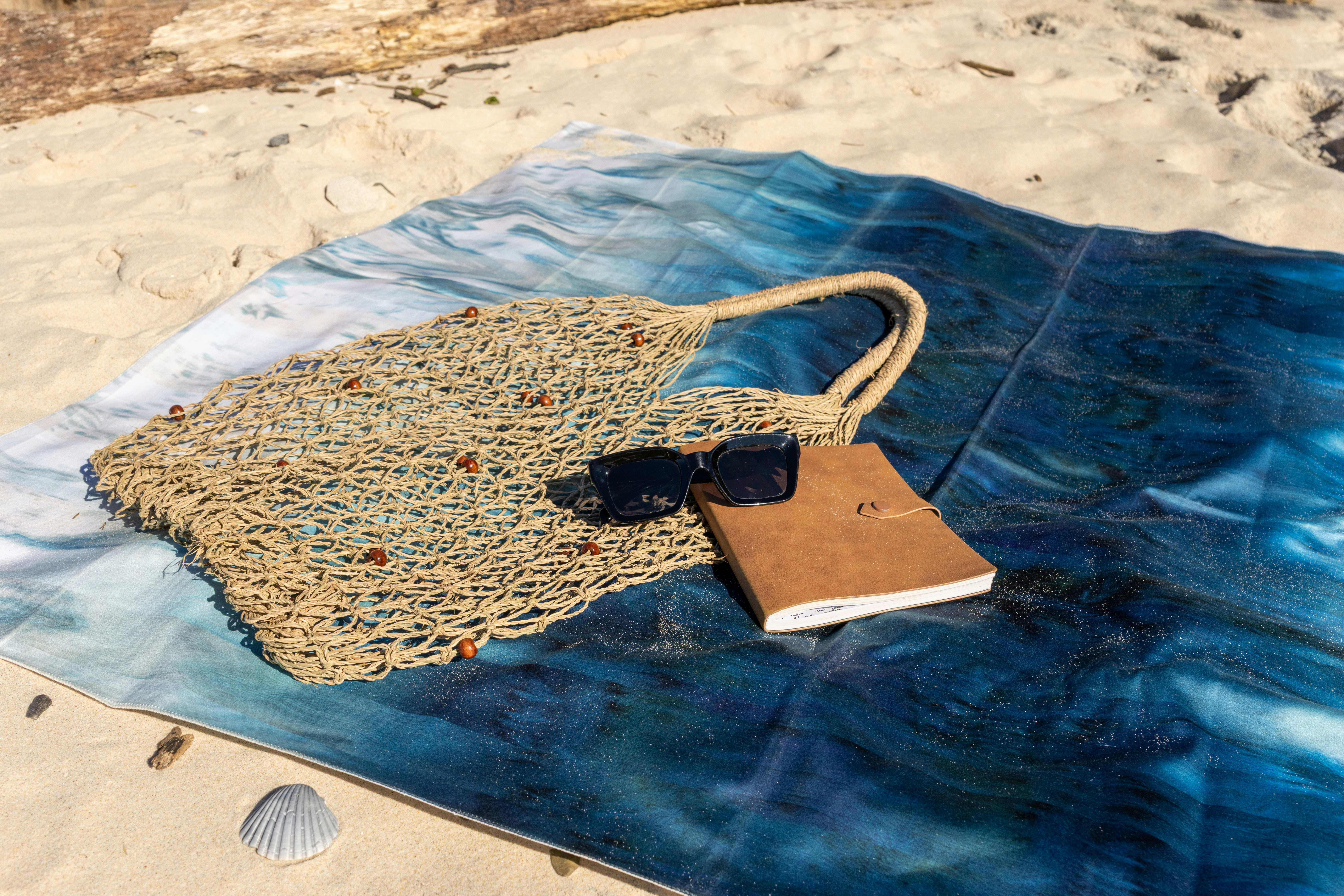 Beach essentials on a towel, ready for a relaxing day.