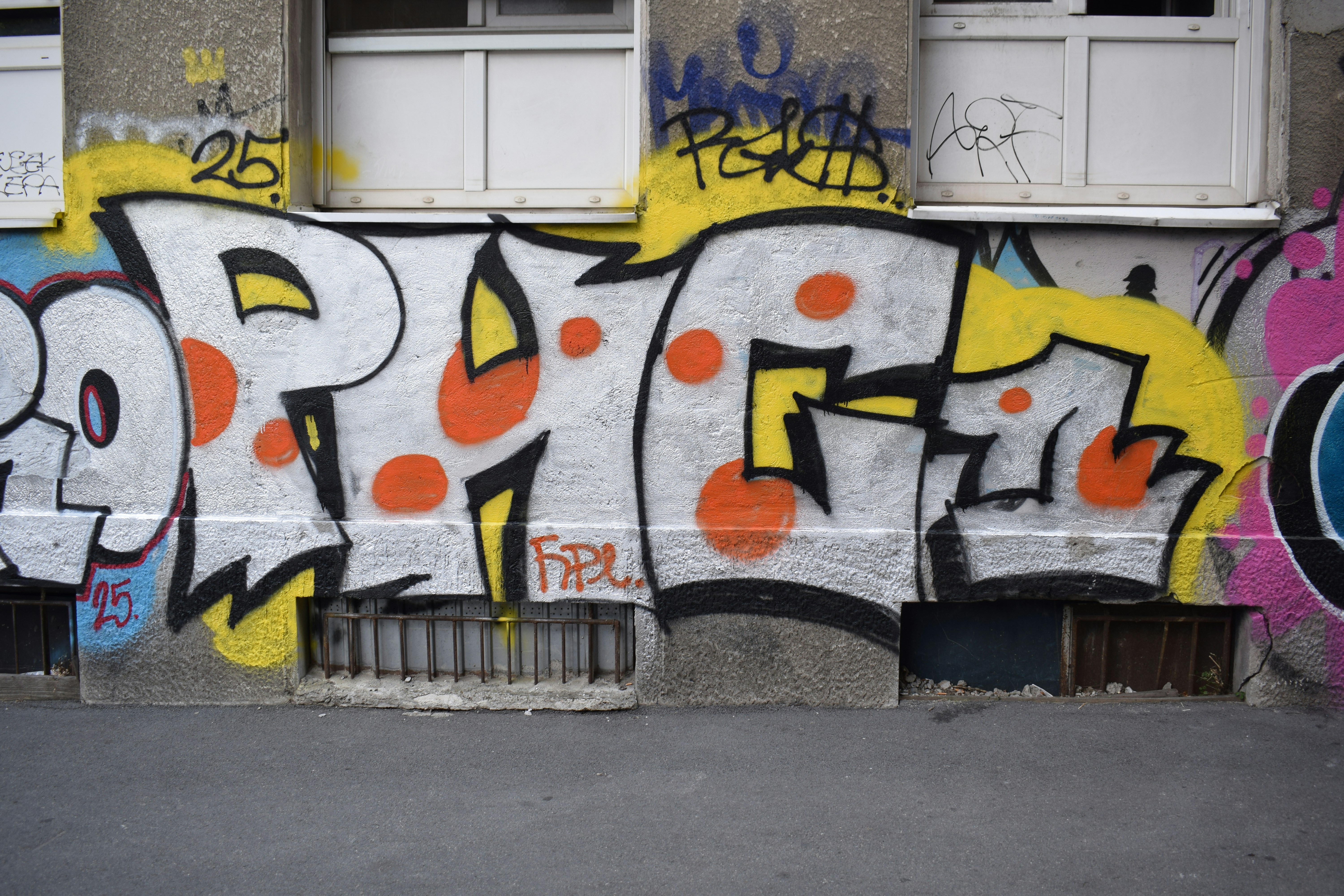 Graffiti art adorns a building's exterior