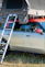 A rooftop tent is mounted on a car.