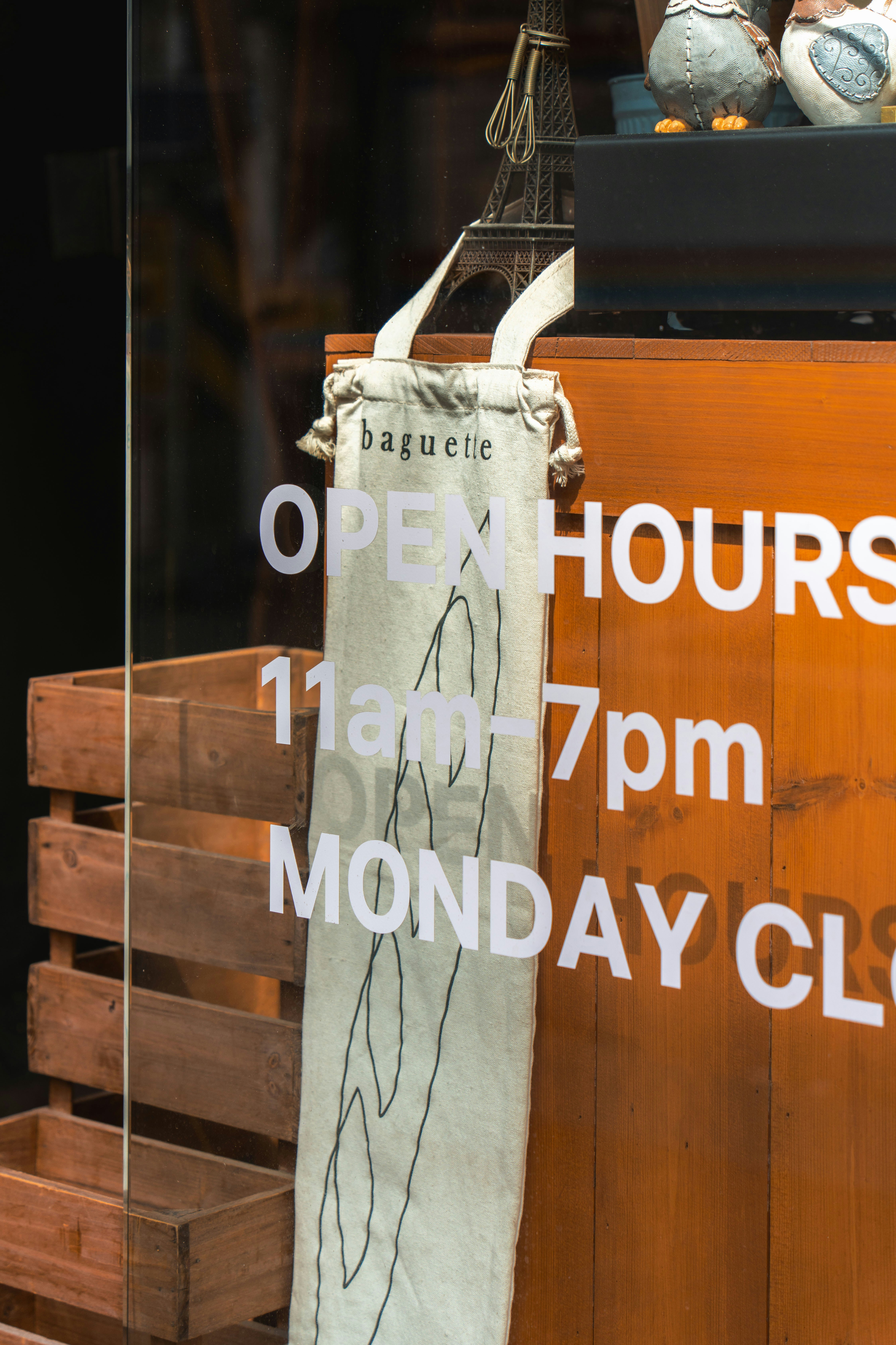 A bakery window with open hours is visible. photo – Free Wood Image on ...