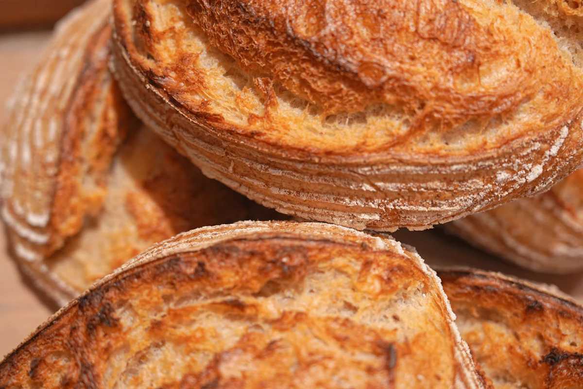 Close-up of a golden freshly baked sourdough boule