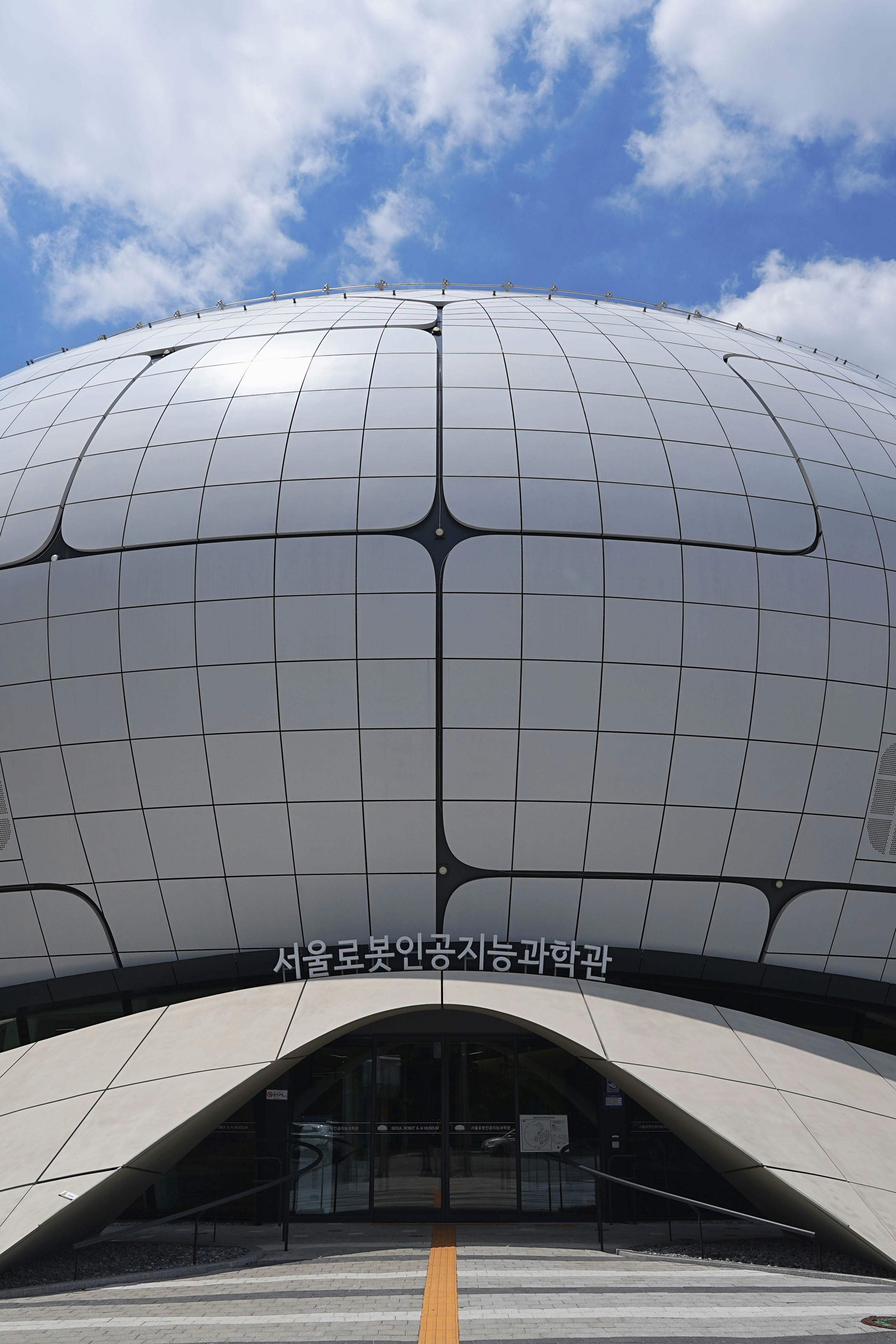 A modern building with an unusual dome.