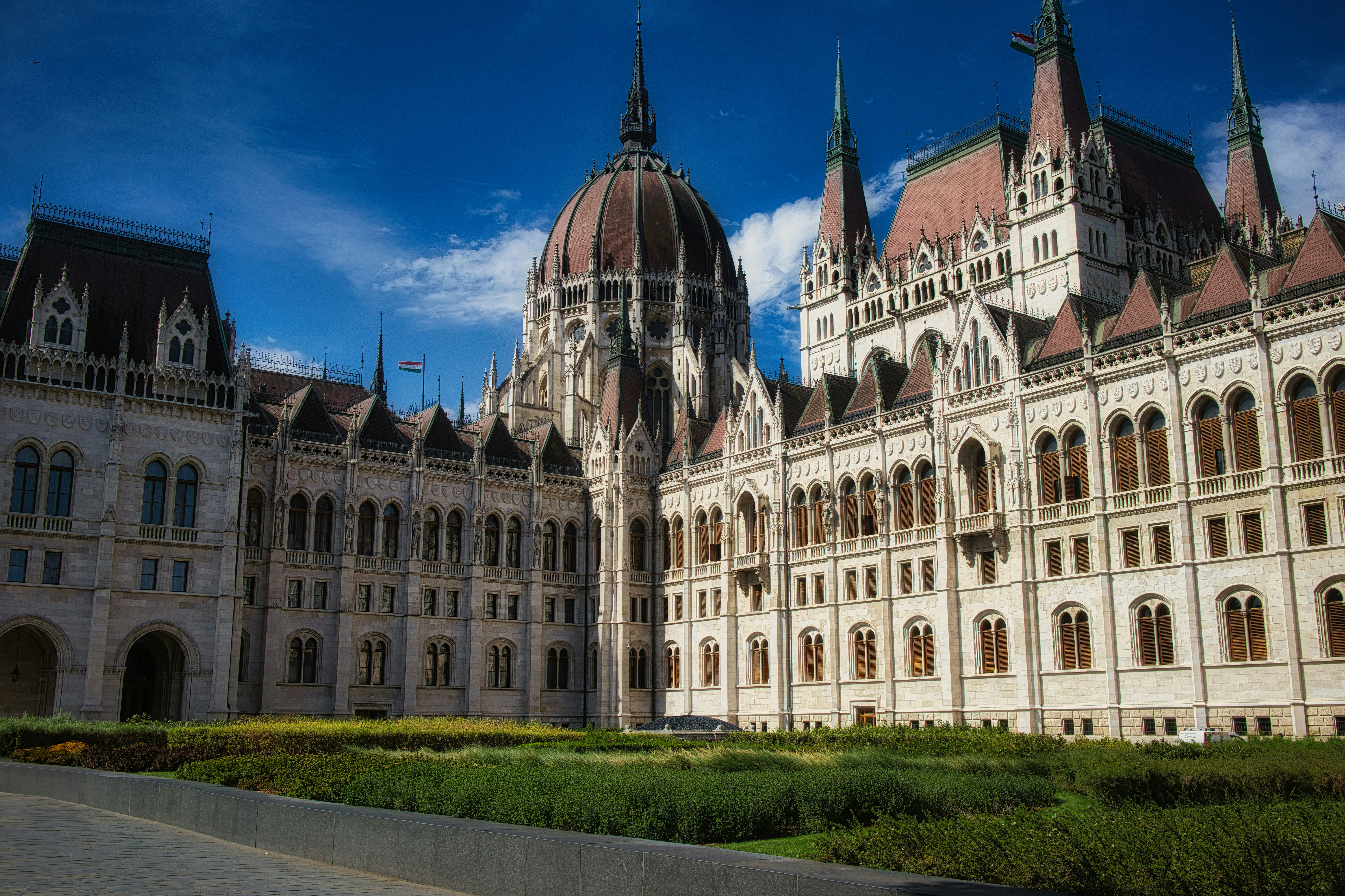The hungarian parliament building stands in sunshine.