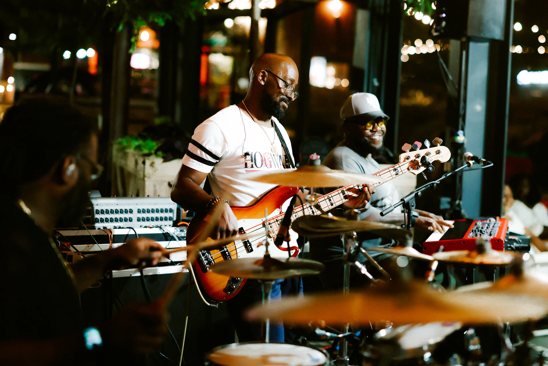 A band performs live on stage.