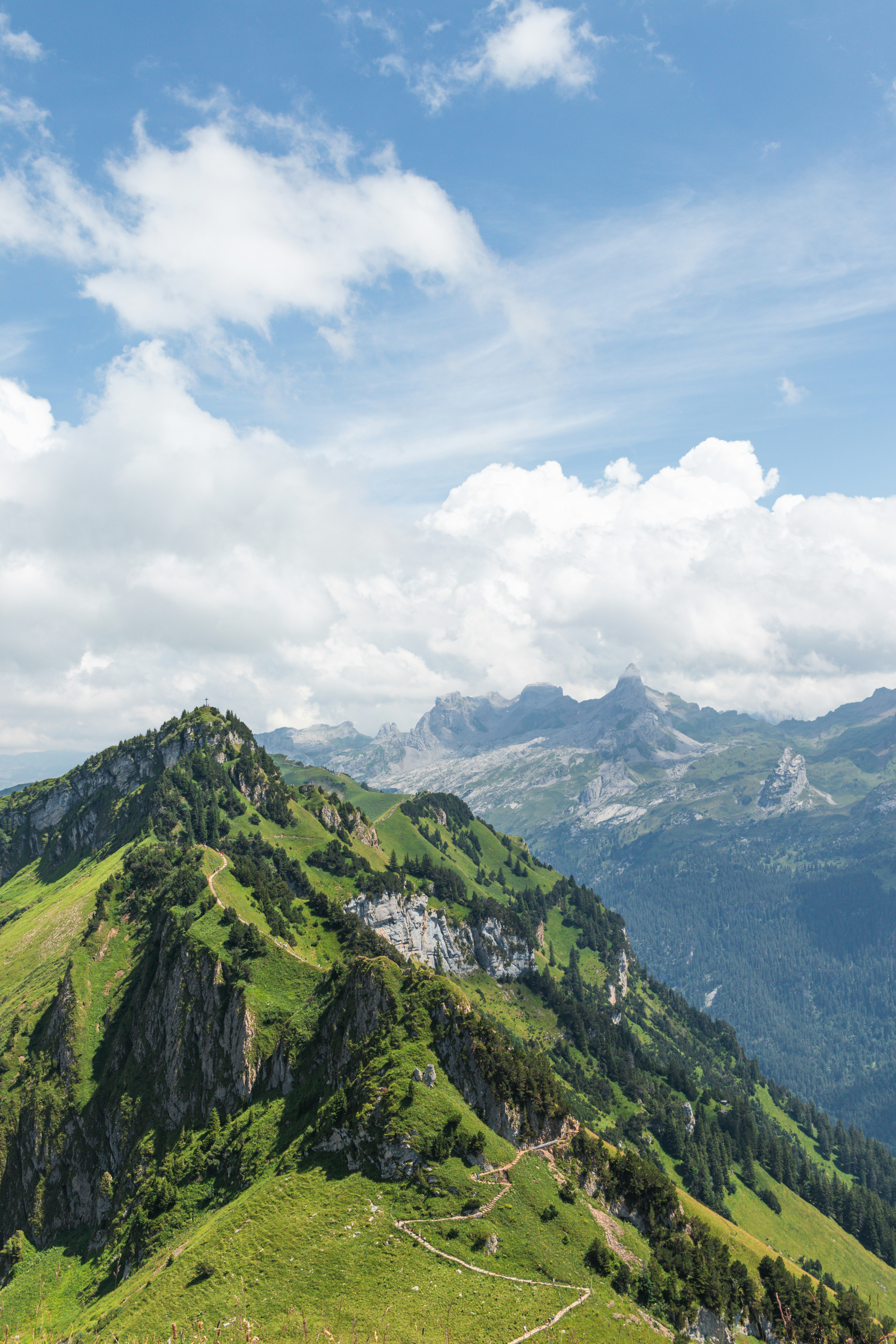 Mountain peaks and cloudy sky fill the scenic vista.