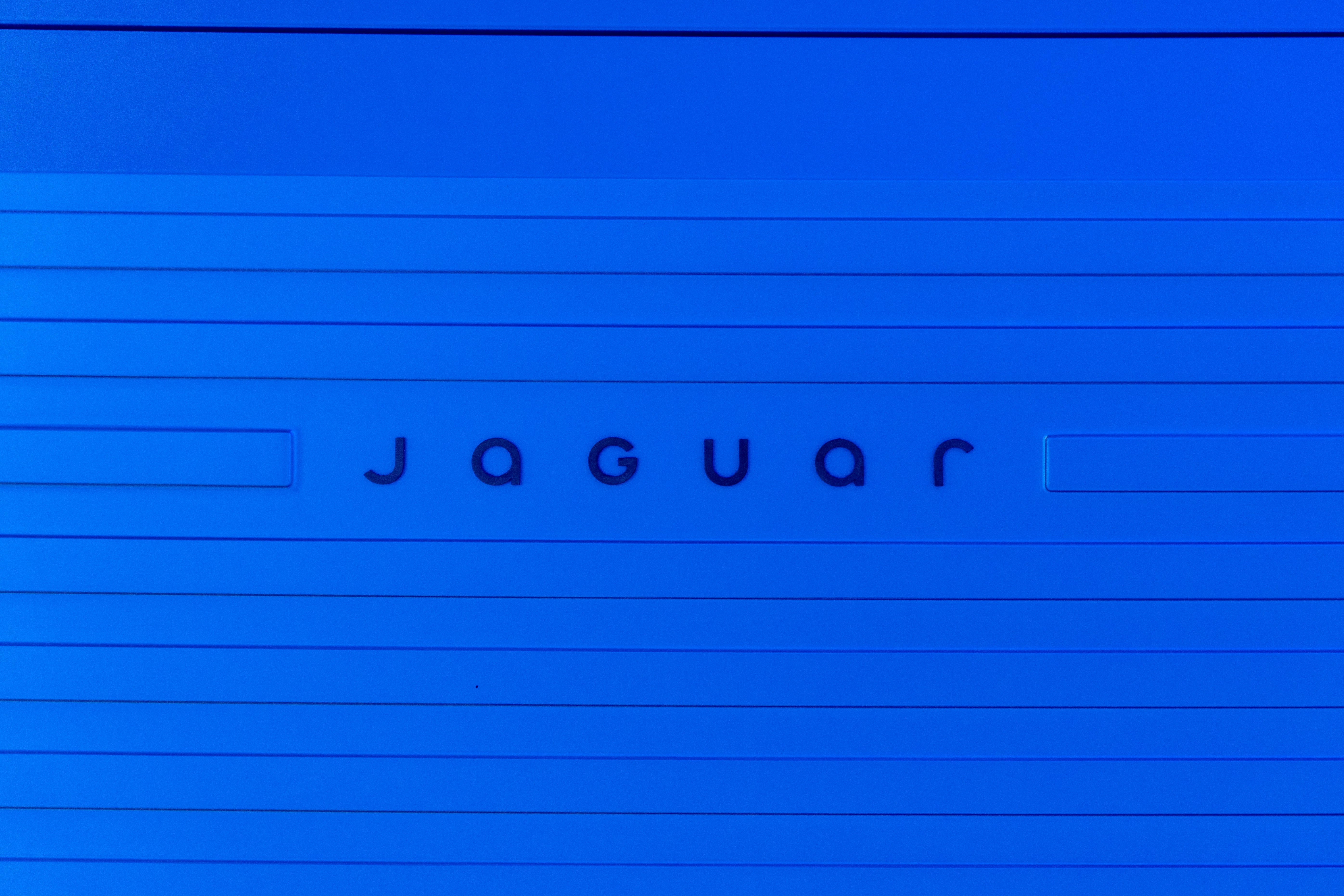 The word "jaguar" is shown on blue paper.