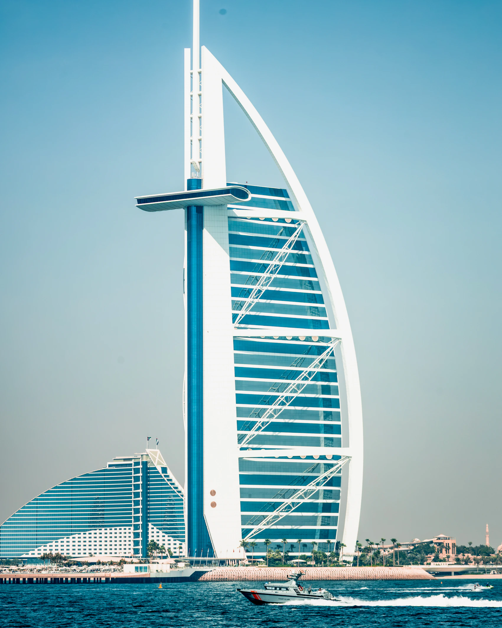 Burj Al Arab beside the blue Arabian Gulf in Dubai