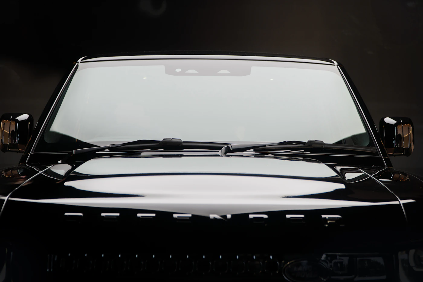 Front windshield of a dark SUV