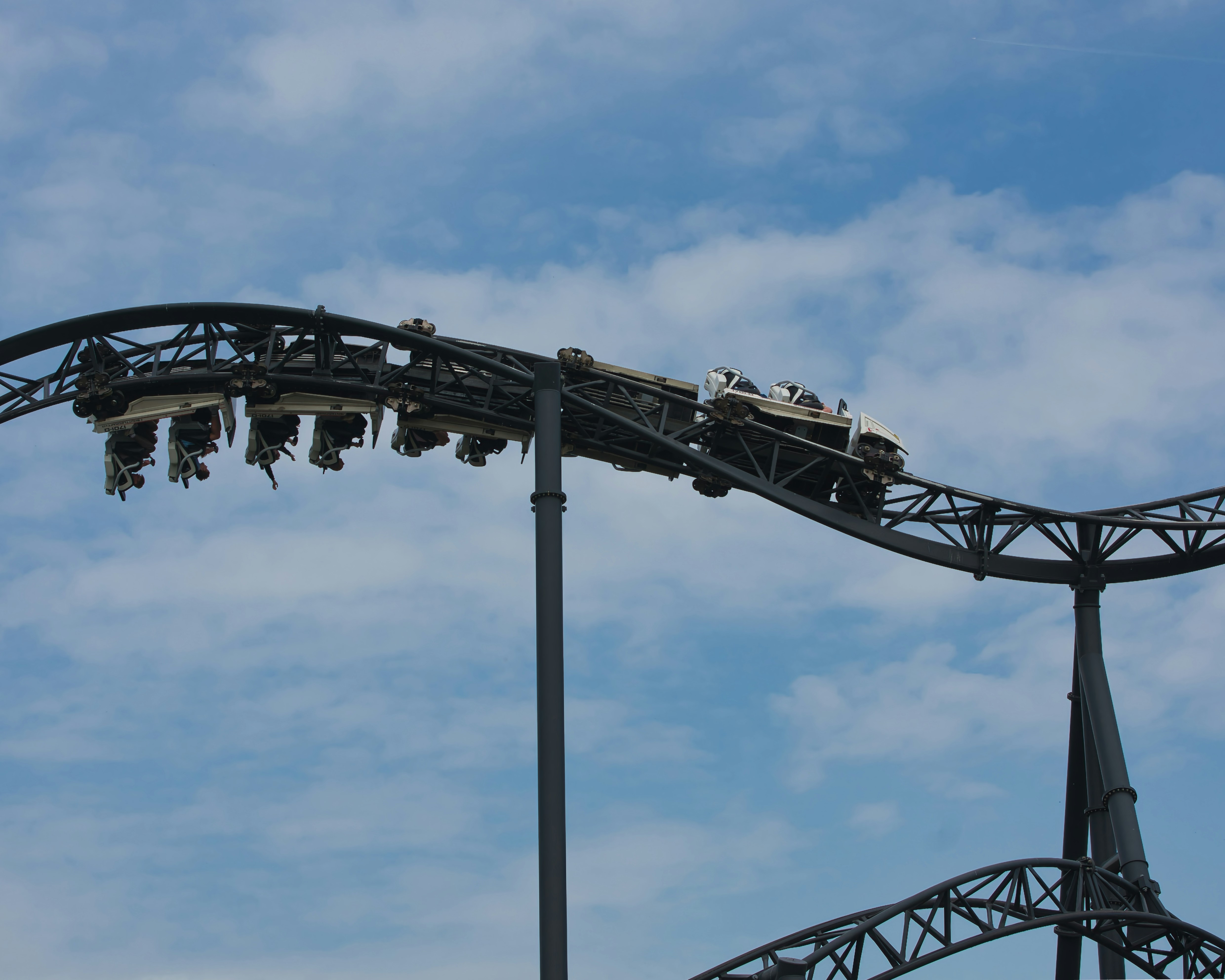 A rollercoaster car climbs a steep section.