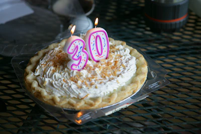 A birthday pie with "30" candles.