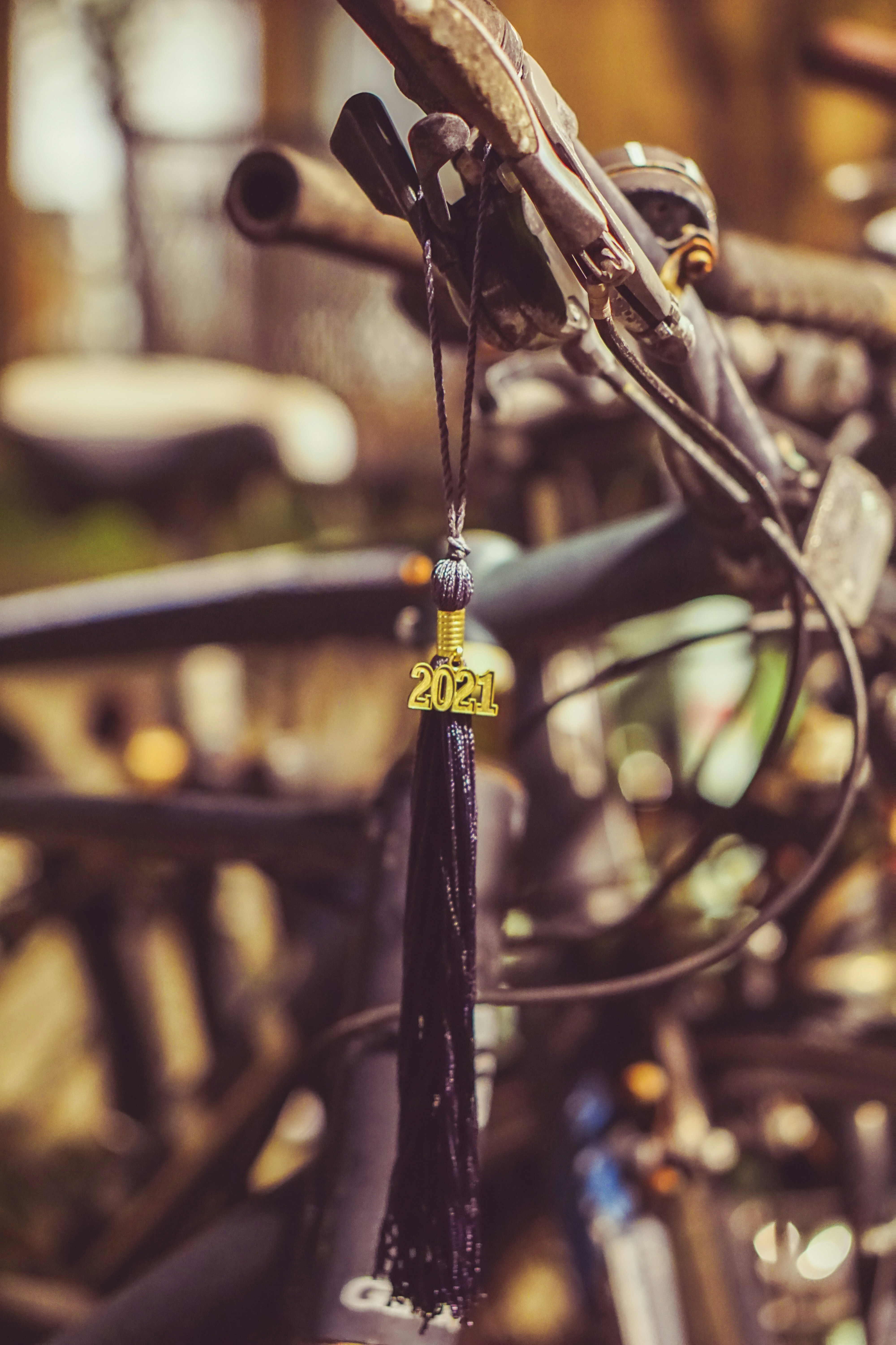 A graduation tassel reads "2021" on bicycle.