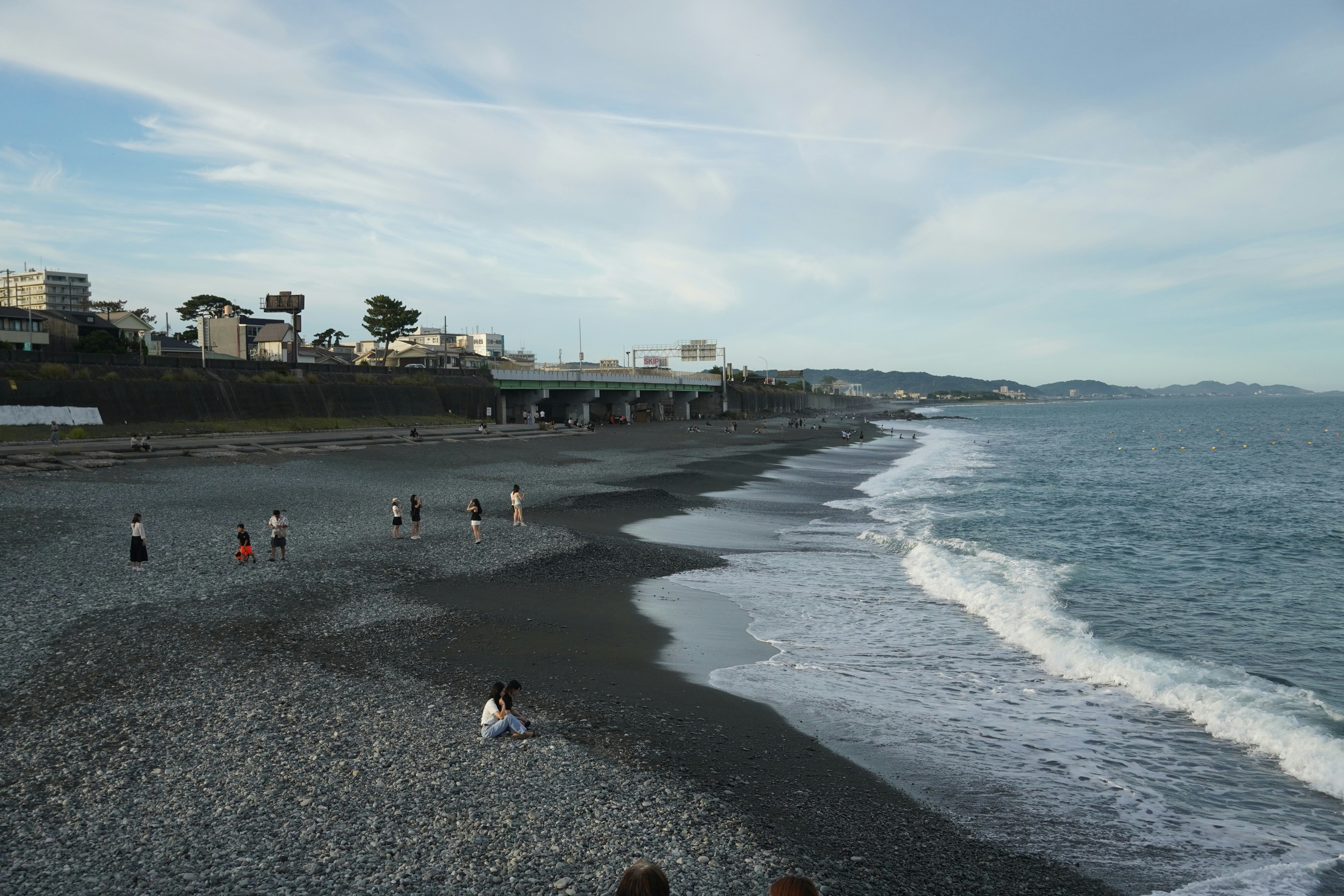 People are enjoying the beach on a sunny day.