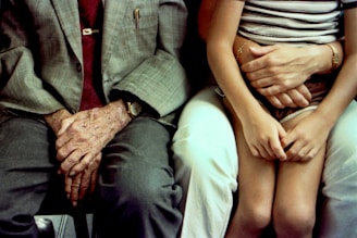 Grandfather's hands comfort a child.
