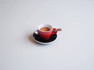 A cup of espresso on a saucer.