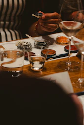 Guests enjoying caviar and wine tasting.