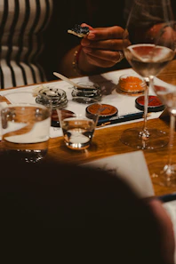 Guests enjoying caviar and wine tasting.