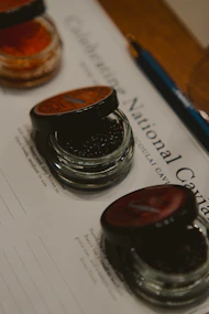 Caviar samples are arranged for tasting on a form.