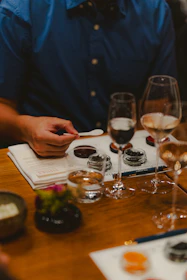 Wine and food tasting happening at a table.