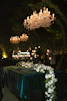 Elegant wedding decorations lit by chandeliers.
