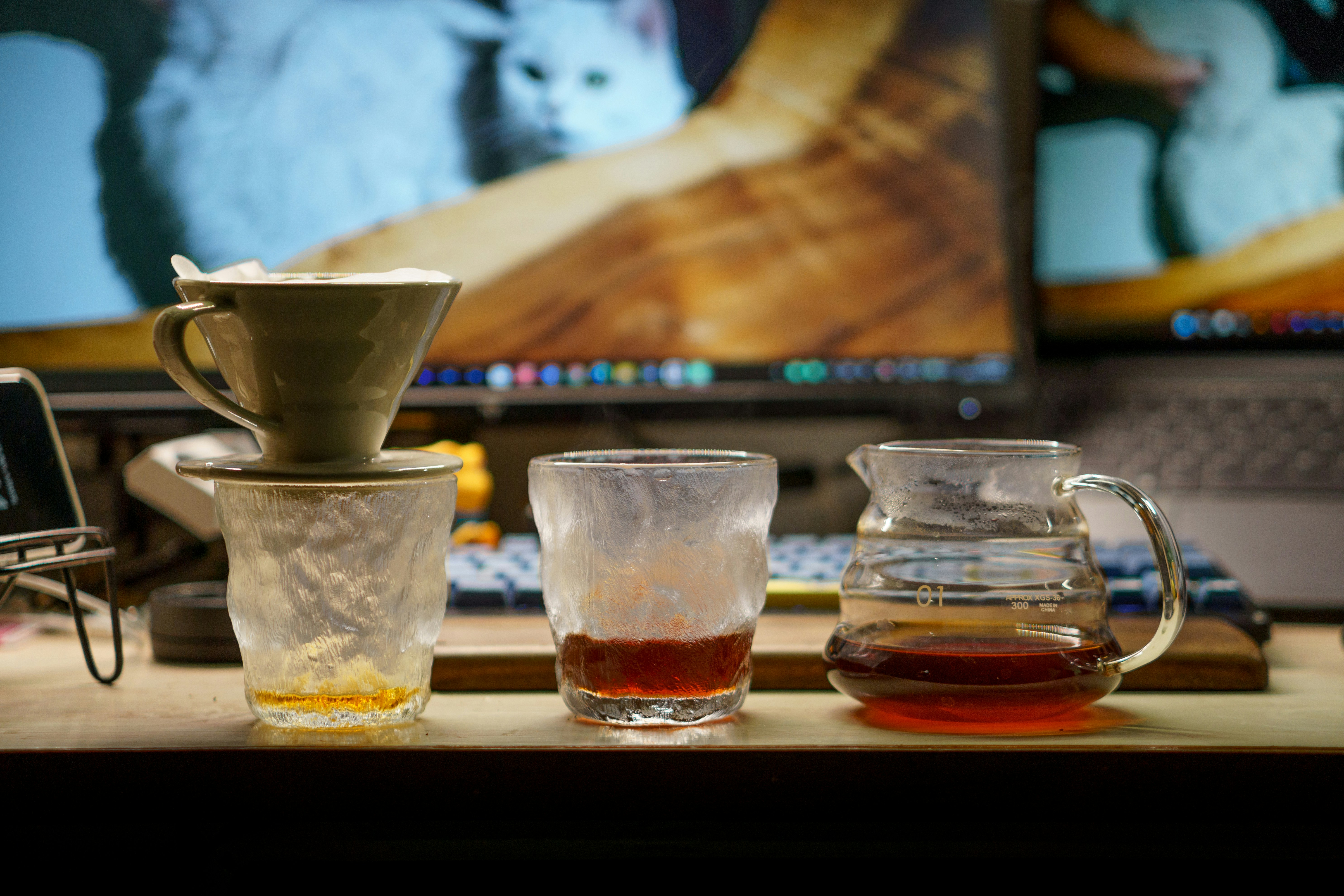 Coffee brewing setup with various vessels.