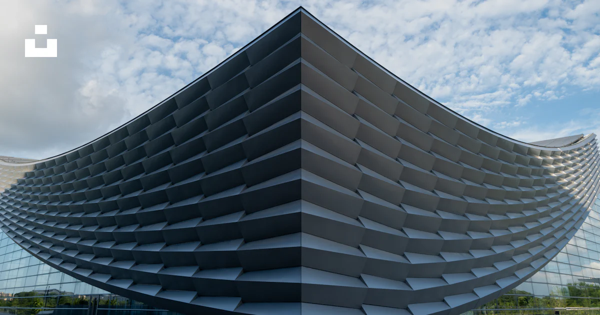 Feature Building A modern building features a unique architectural design. photo – Free ...
