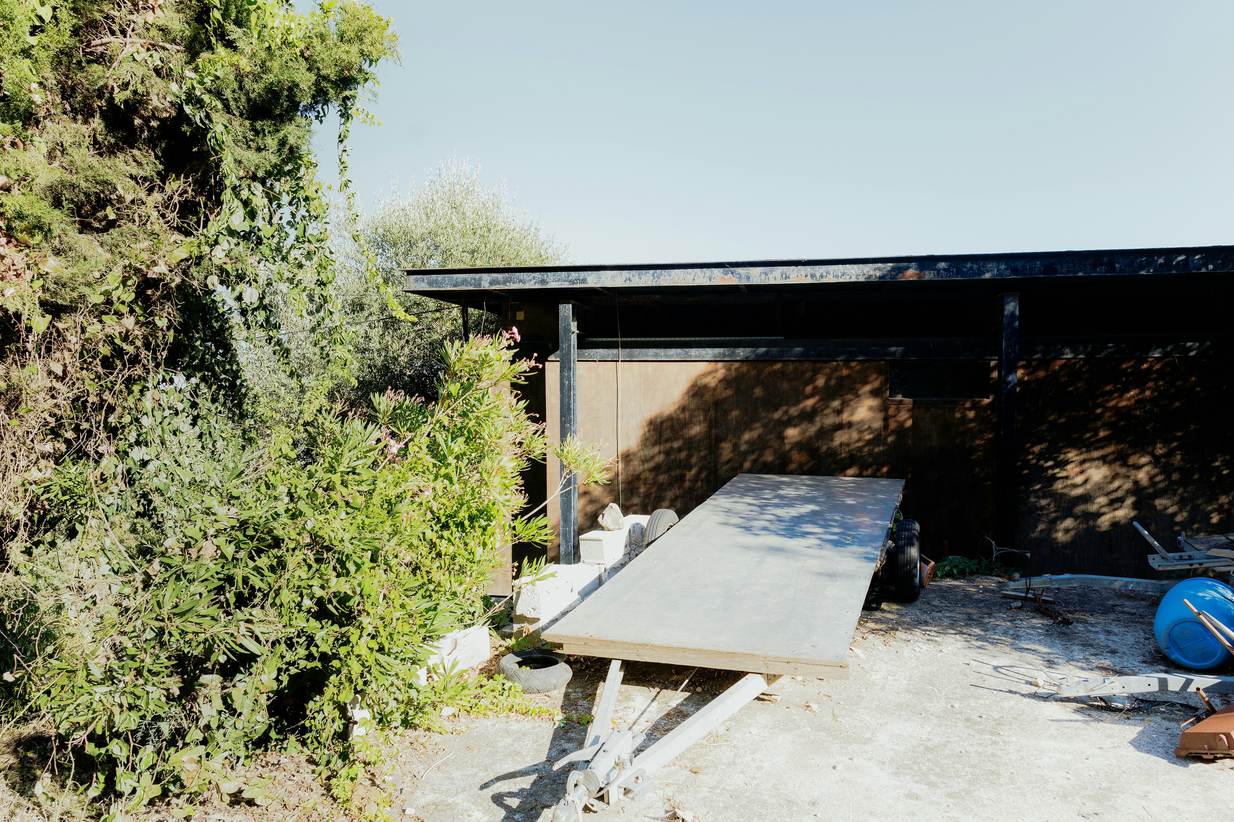 A wooden ramp leads into a building.