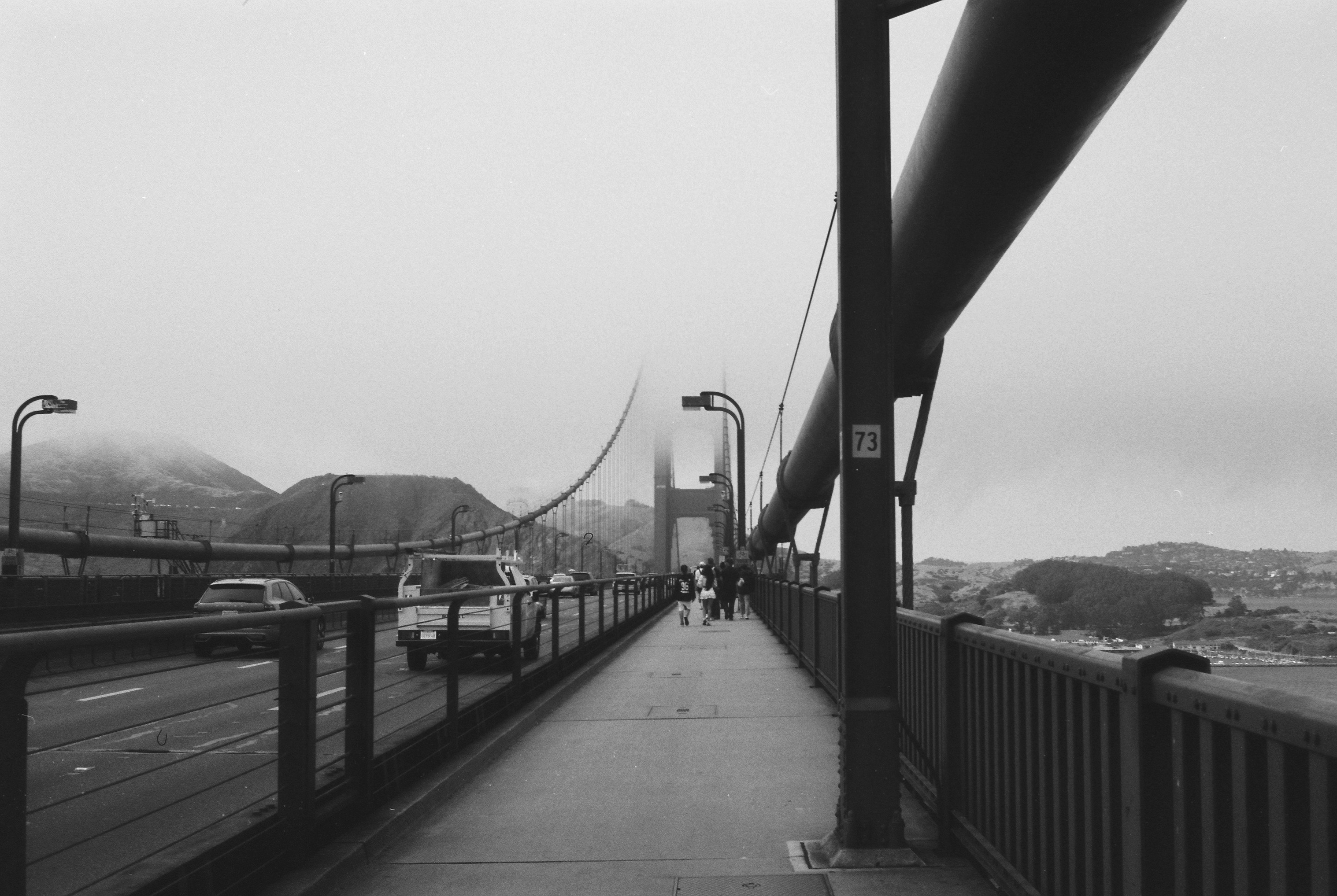 The golden gate bridge in dense fog.