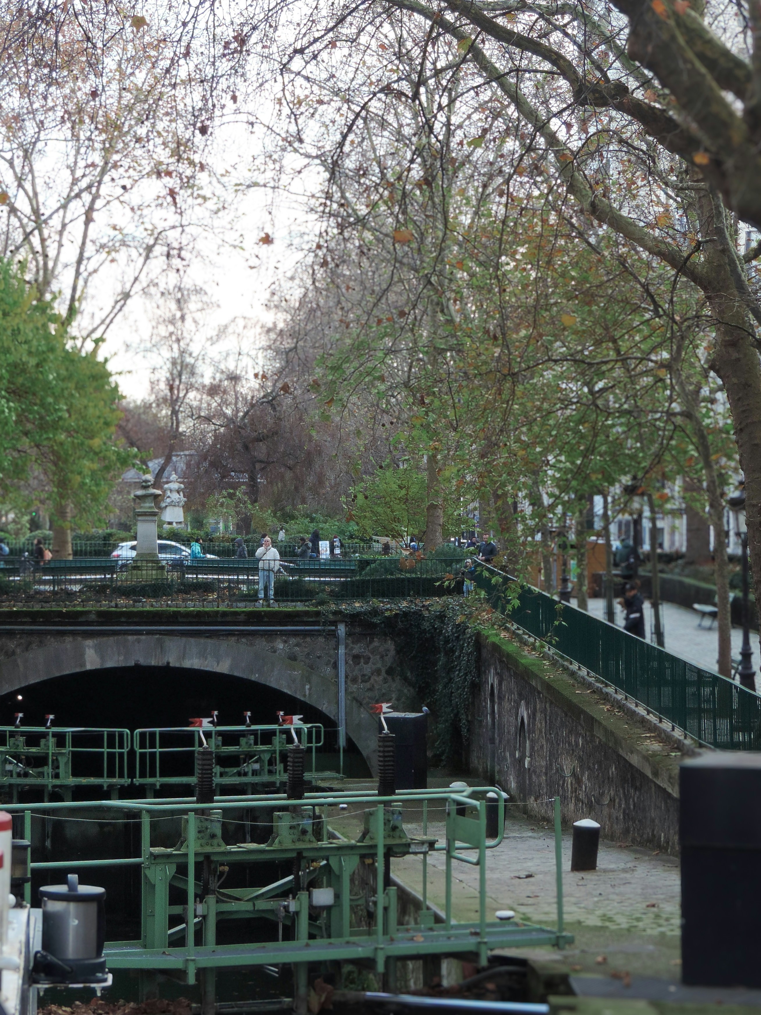 A canal is seen under a bridge.