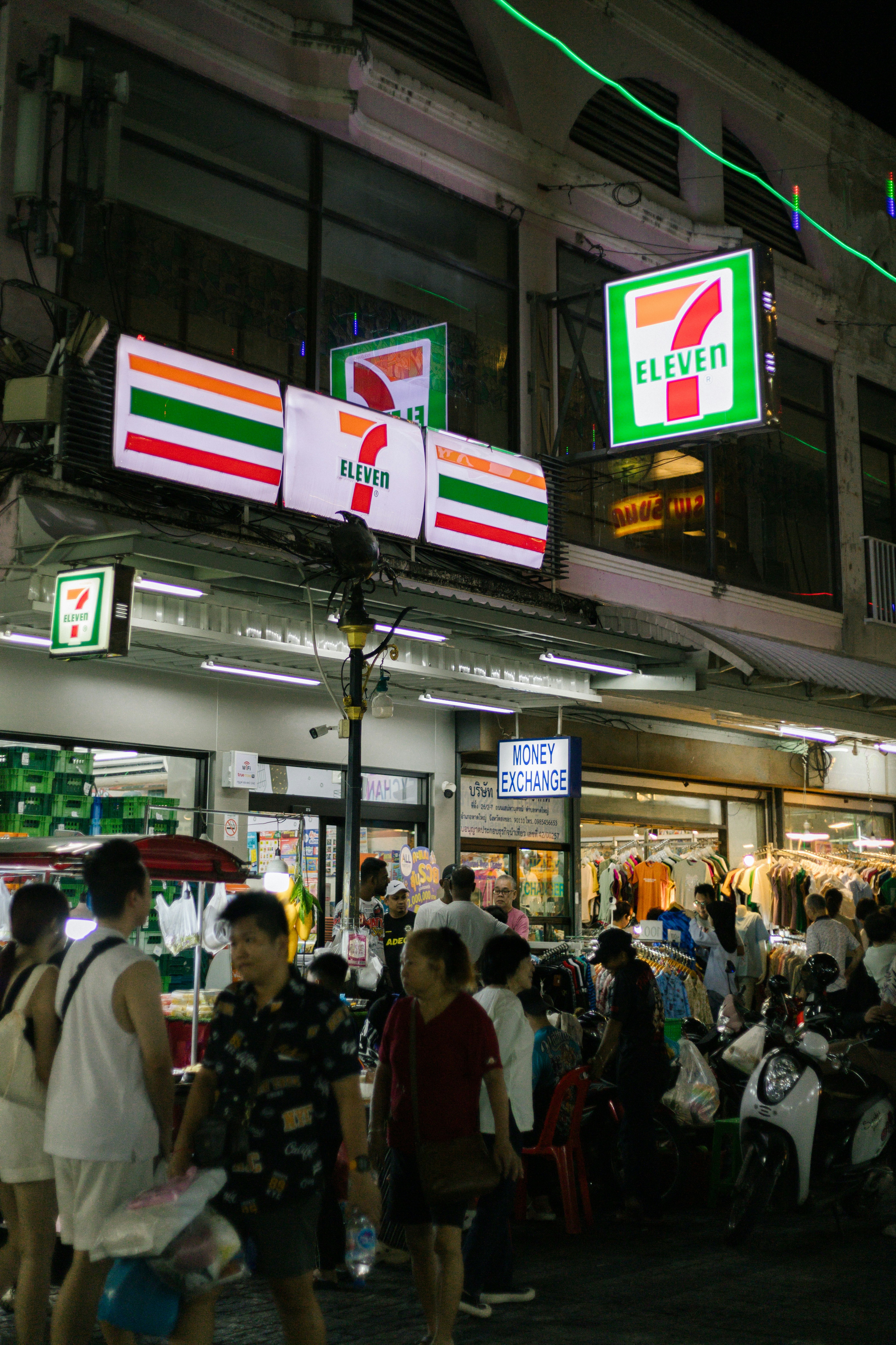 A Thai 7-Eleven store busy at night
