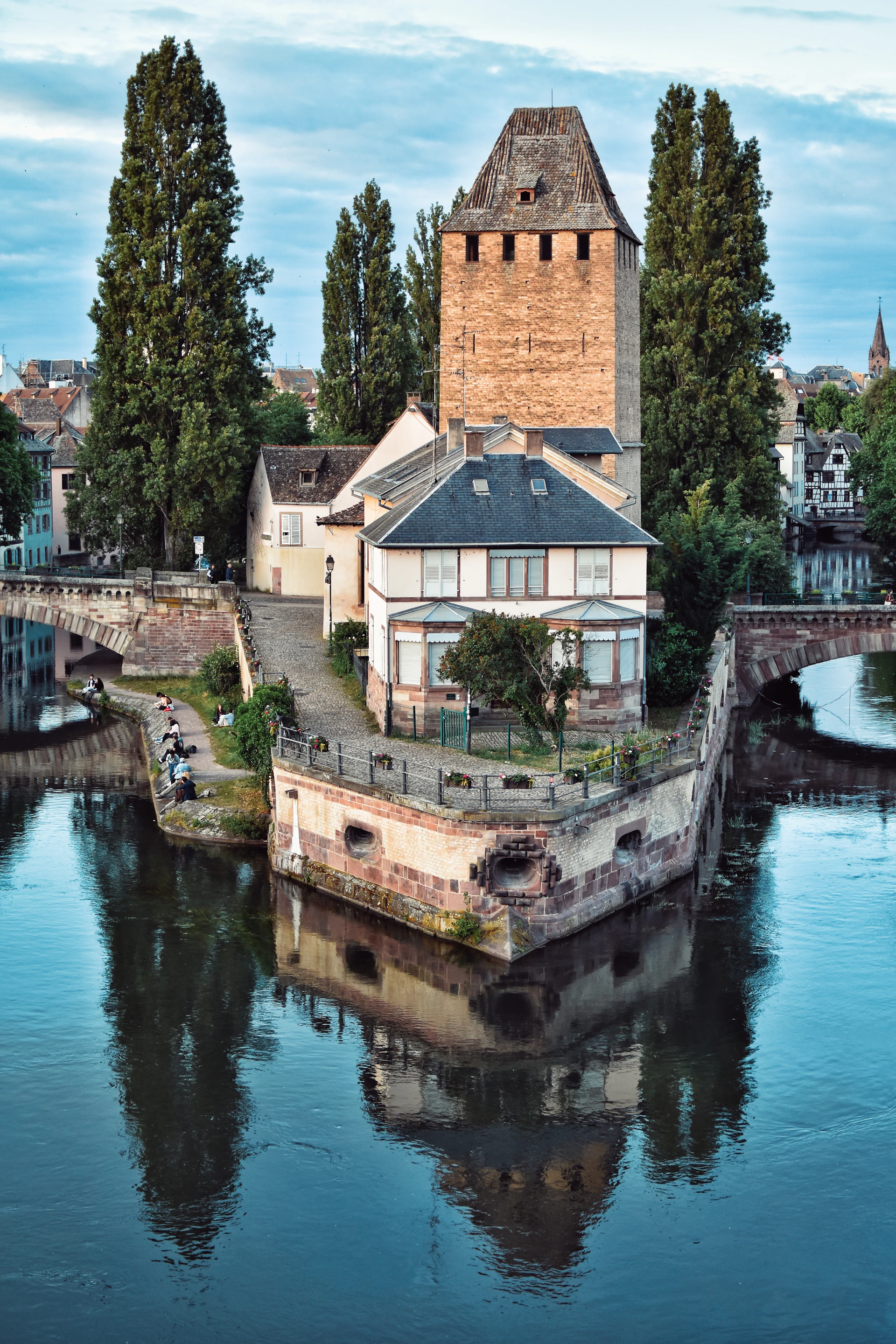 A picturesque building sits on the river.