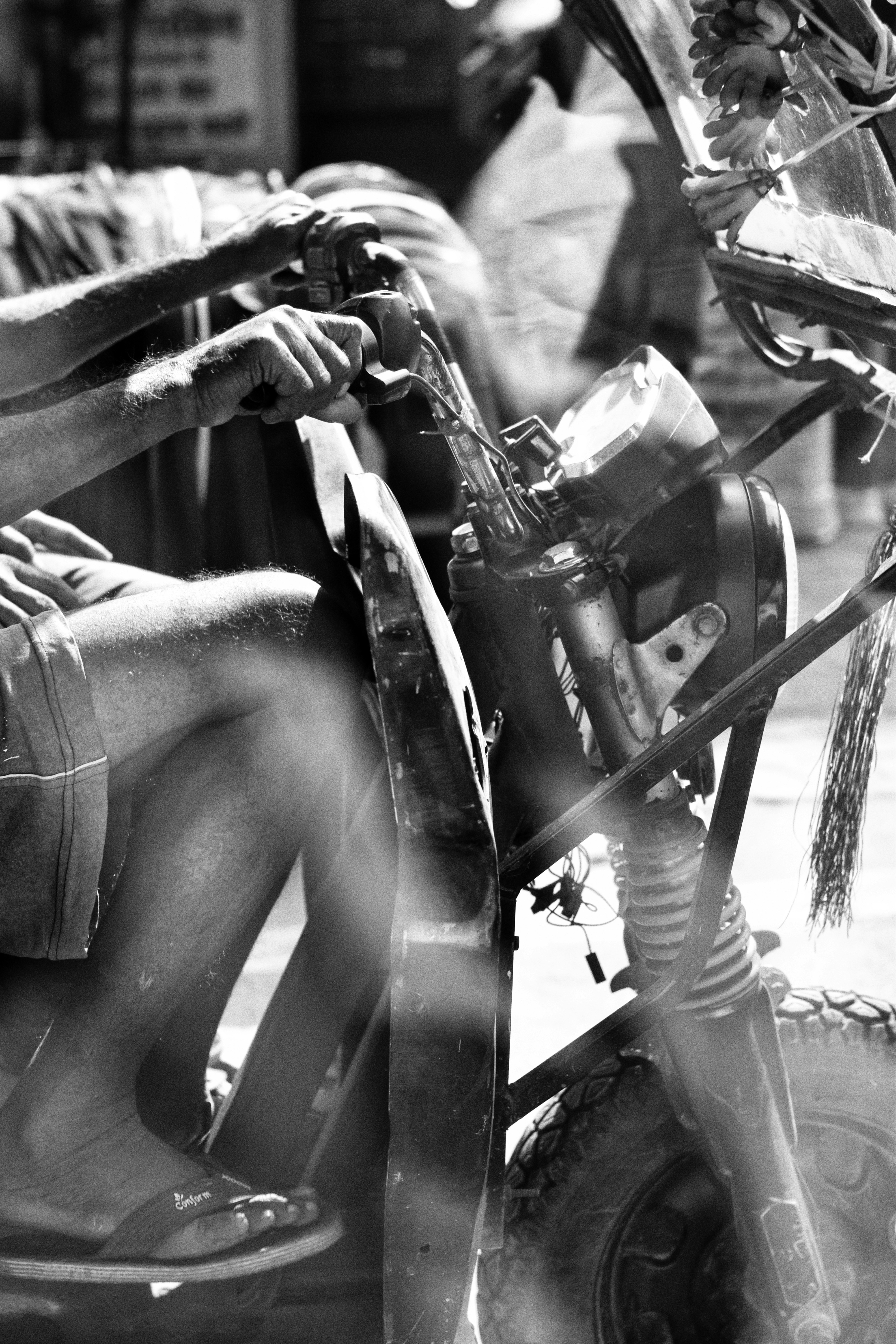 Man on a motorcycle, close-up view.