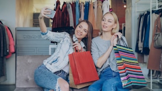 Two friends take a selfie after shopping.