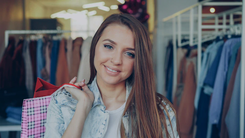 Woman smiling while shopping for new outfits