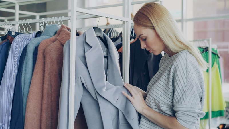 Woman examining clothing on a rack