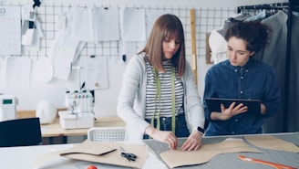Two fashion designers work in a design studio.
